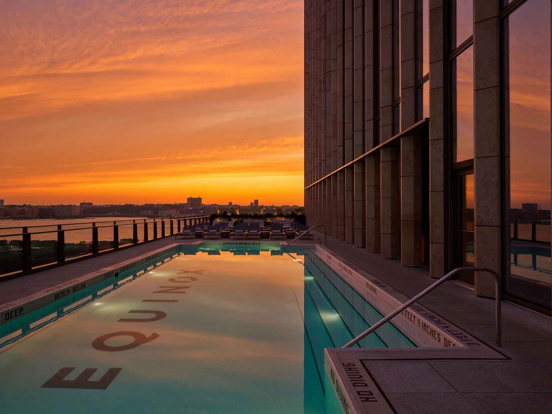 Outdoor rooftop pool at Equinox Hotel New York